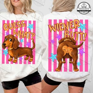May include: White sweatshirt with a dachshund illustration and the text "GUESS WHAT?" on the front. The back features a dachshund's rear with the text "WIENER BUTT!" on a pink striped background with star accents.
