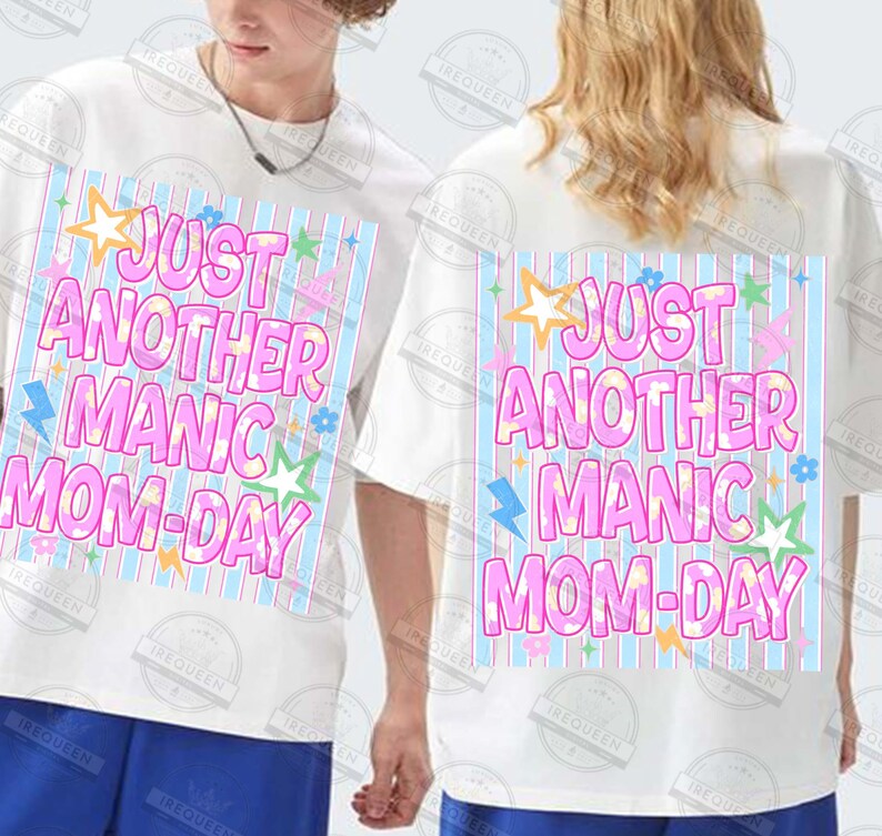May include: White t-shirts with the text "JUST ANOTHER MANIC MOM-DAY" in pink, blue, and yellow. The design includes stars, lightning bolts, and flowers. The shirts are short-sleeved.