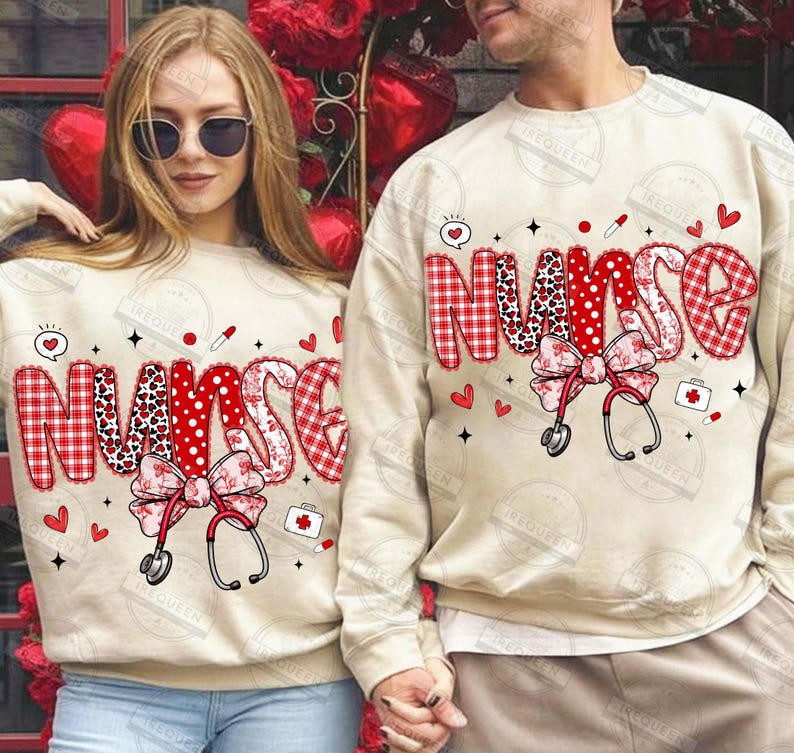 May include: Beige sweatshirts with the word "NURSE" in red and white patterned letters. Each sweatshirt features a bow, stethoscope, hearts, and medical-themed graphics. The sweatshirts are a matching set.