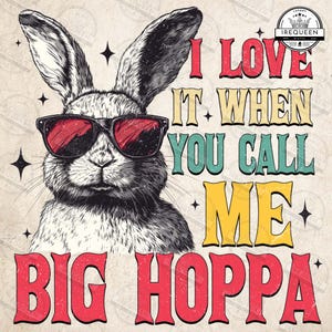 May include: A vintage-style graphic featuring a black and white rabbit wearing sunglasses with red lenses. The text reads "I LOVE IT WHEN YOU CALL ME BIG HOPPA" in various colors and fonts. The design includes star accents.