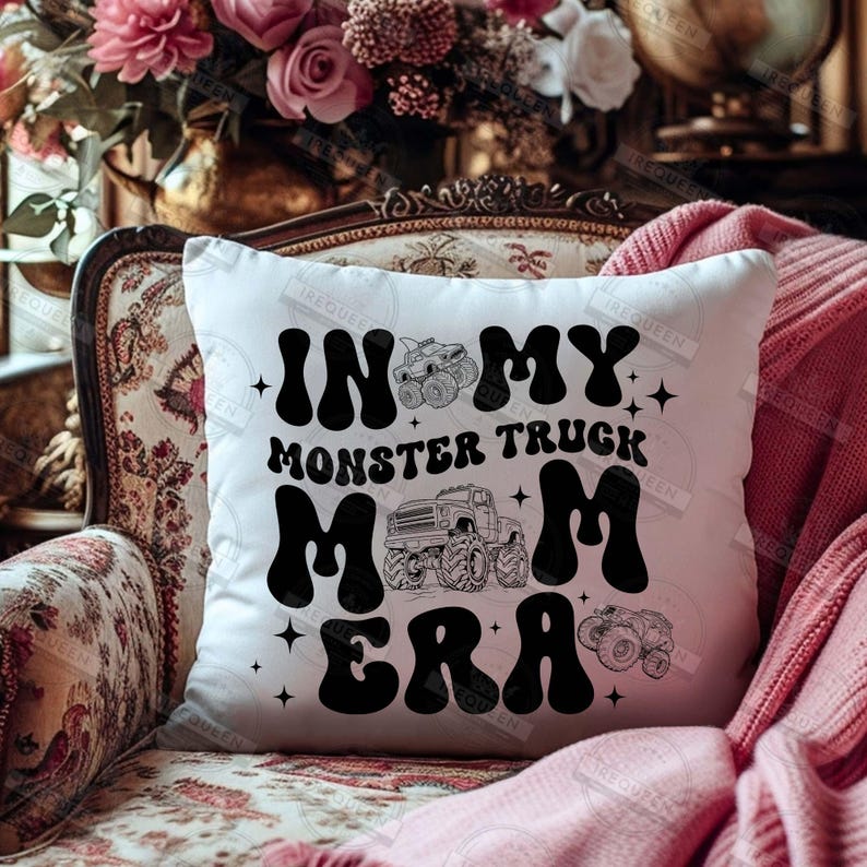May include: White throw pillow with black text that reads "In My Monster Truck Mom Era" with a monster truck graphic.