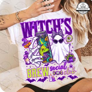 May include: A white t-shirt featuring a graphic of a skeleton hand holding a can, a ghost wearing a leopard print bow and sunglasses, pumpkins, a lantern, and bats. The text reads WITCH'S BREW social club in purple and lime green lettering.