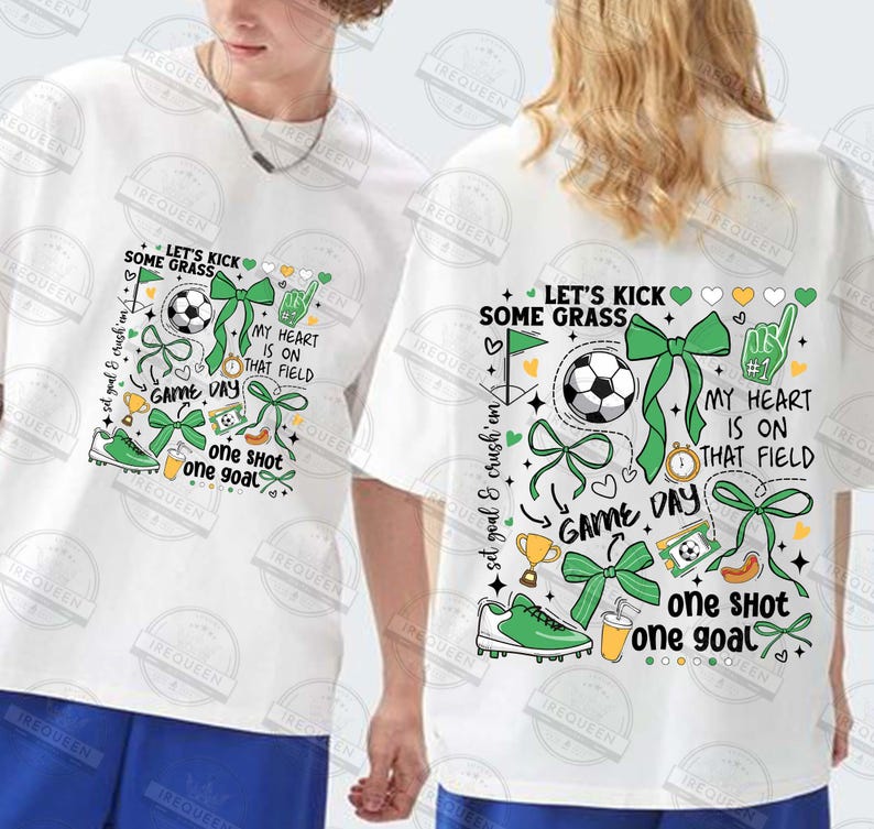 May include: White t-shirt with a green, white, and yellow graphic design featuring a soccer ball, bows, hearts, and the text "Let's Kick Some Grass", "My Heart Is On That Field", "Game Day", and "One Shot One Goal".