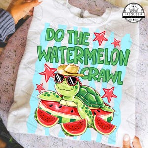 May include: White sweatshirt with a graphic that says "DO THE WATERMELON CRAWL". The design features a cartoon turtle wearing sunglasses and a hat, resting on watermelon slices, with red star accents.