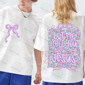 May include: White t-shirts with a purple bow design on the front and back. The back of the shirt features the text "Let Me Tell You About My Jesus" in a floral design with a purple bow.