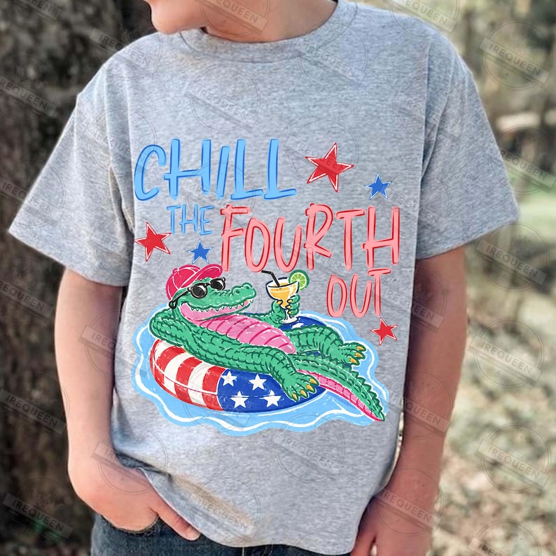 May include: A grey t-shirt with a cartoon alligator wearing sunglasses and a hat, relaxing on a red, white, and blue float with a drink. The text "Chill the Fourth Out" is in blue and red, with star accents.