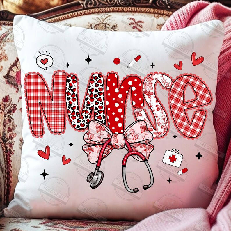 May include: White decorative pillow with the word "NURSE" in red and white patterns. The pillow features a bow, stethoscope, hearts, and medical-themed illustrations. The pillow is a square shape.