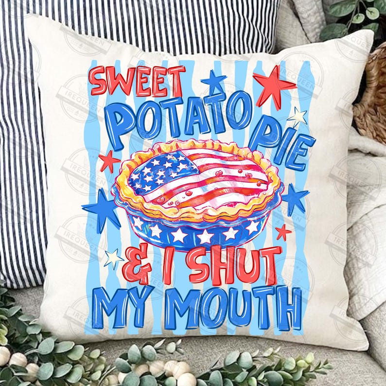 May include: A white pillow with a patriotic design. The pillow features the text "Sweet Potato Pie & I Shut My Mouth" in red and blue. A pie with an American flag design is in the center, surrounded by stars.