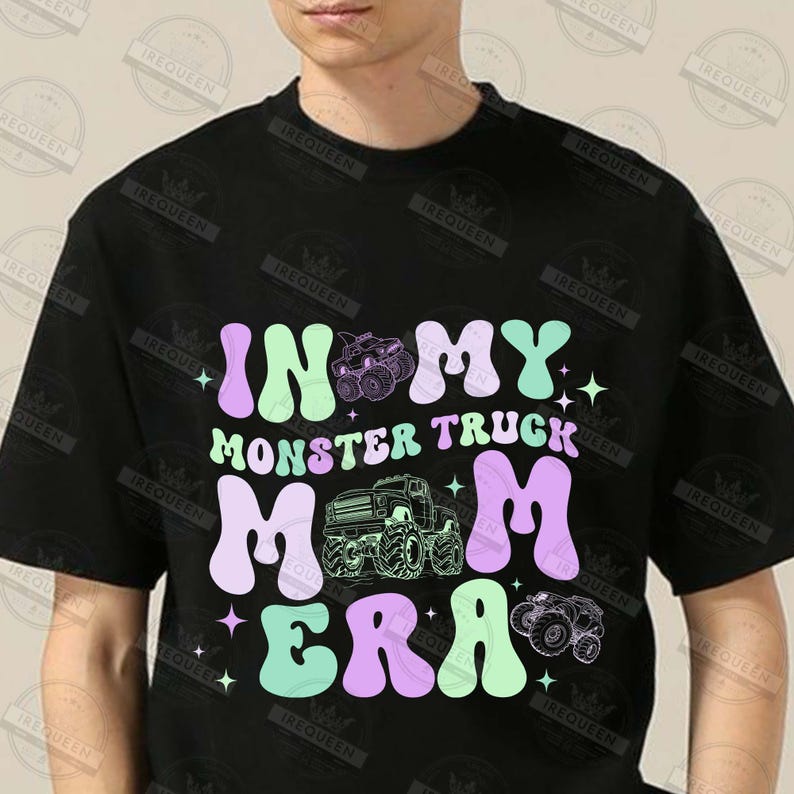 May include: Black t-shirt with a graphic design that says "In My Monster Truck Mom Era" in a retro font. The graphic features a monster truck and stars.
