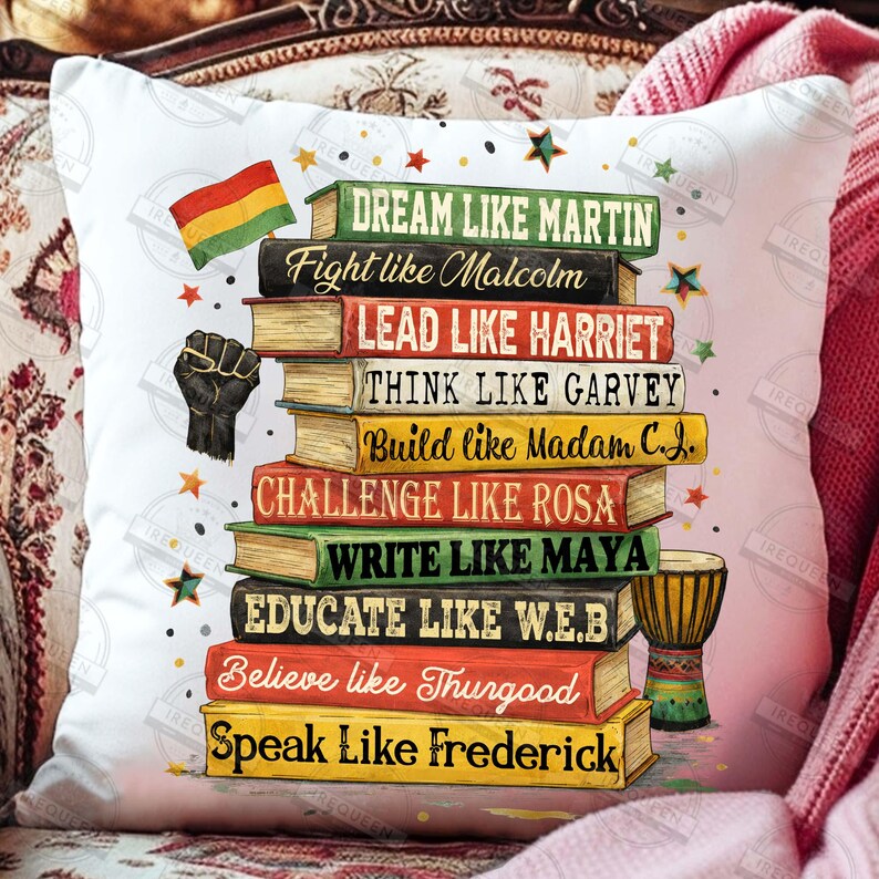 May include: White square pillow with a stack of books featuring inspirational quotes like "Dream like Martin" and "Fight like Malcolm." Includes a black power fist, a flag, stars, and a small drum.