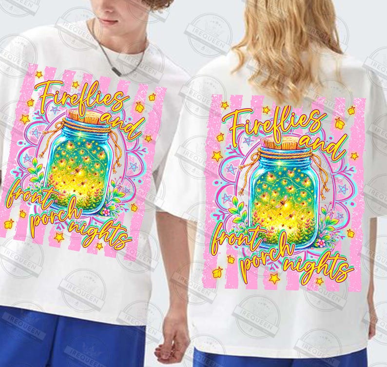May include: White t-shirts with a colorful graphic design. The design features a mason jar filled with fireflies, surrounded by a pink and yellow floral pattern, and the text "Fireflies and front porch nights."