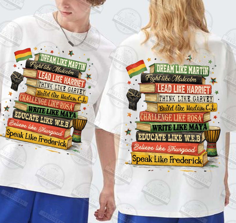 May include: White t-shirts with a colorful graphic design featuring a stack of books. The books have titles like "Dream Like Martin" and "Speak Like Frederick." A black fist and a flag are also included in the design.