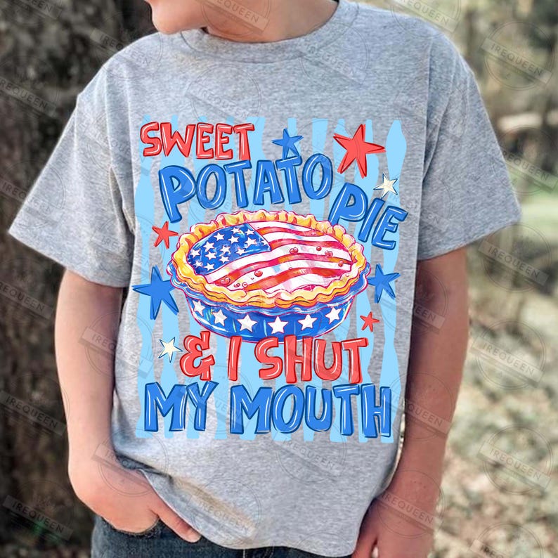 May include: A gray t-shirt featuring a graphic design with the text "SWEET POTATO PIE & I SHUT MY MOUTH". The design includes a pie with an American flag design, red stars, and blue accents.