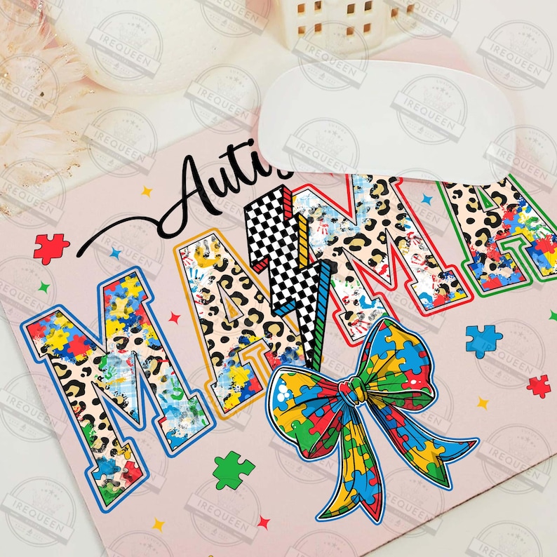May include: A pink background with the words "Autism Mama" in colorful letters with a leopard print and puzzle piece pattern. A large blue, yellow, green, and red puzzle piece bow is in the center of the design.