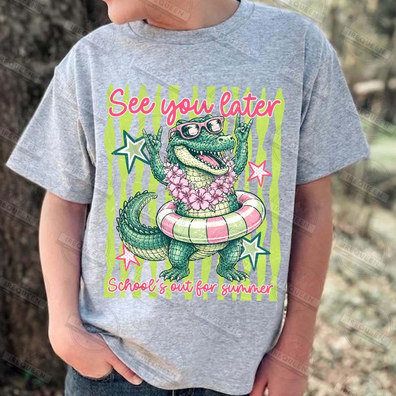 May include: A gray t-shirt featuring a cartoon alligator wearing sunglasses, a flower lei, and a swim ring. The text "See you later" and "School's out for summer" are displayed in pink and green.