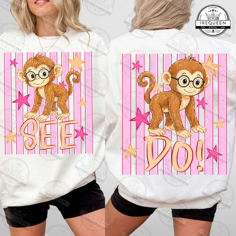 Puede incluir: Sudadera blanca con un mono de dibujos animados con gafas y la palabra "SEE" impresa debajo. El dise&ntilde;o incluye rayas rosas y blancas, estrellas rosas y estrellas amarillas.