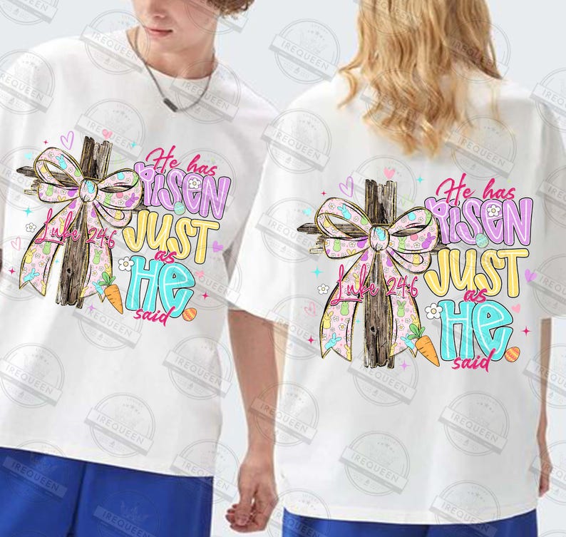 May include: White t-shirts with a colorful graphic featuring a wooden cross, a patterned bow, and the text "He has Risen, Just as He said." The design includes pastel colors and Easter-themed elements.