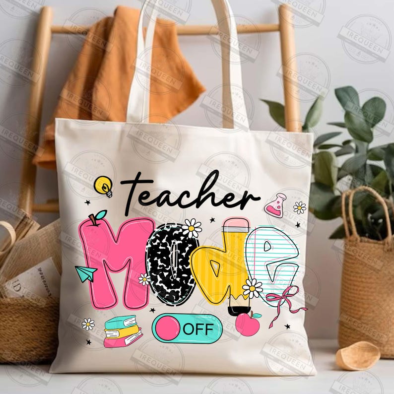 May include: White canvas tote bag with the words "teacher mode" in colorful letters. The letters are decorated with school-themed graphics like a lightbulb, pencil, apple, and books. The words "OFF" are on a pink and blue toggle switch.