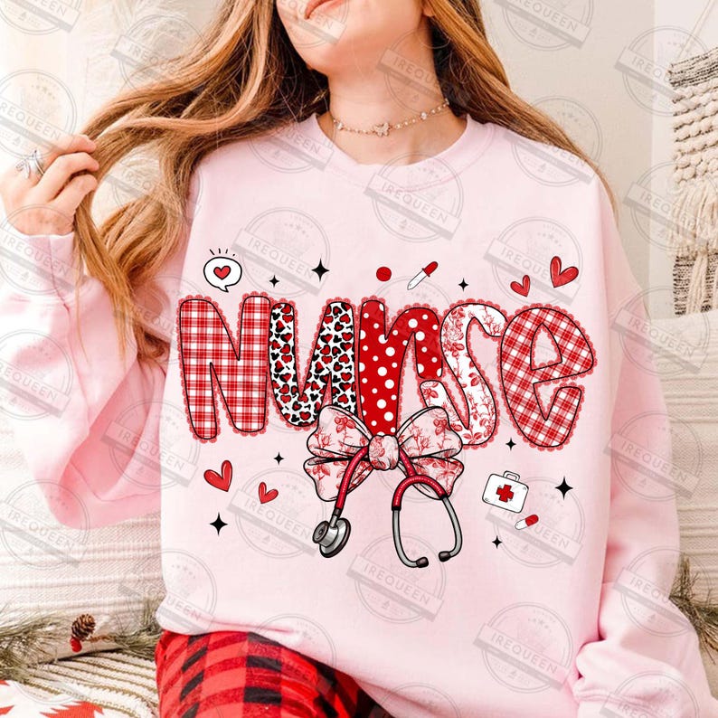 May include: A light pink sweatshirt with the word "NURSE" in a decorative font. The letters have various patterns, including red plaid, hearts, and polka dots. A stethoscope, bow, and medical icons are also featured.