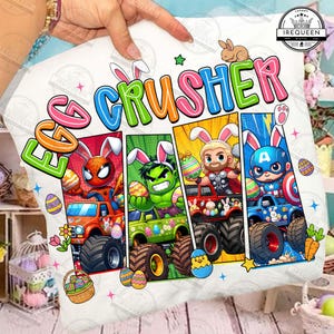 May include: A white pillow with the words "EGG CRUSHER" in colorful letters. The pillow features comic book style illustrations of superheroes in monster trucks with Easter eggs and bunny ears. A fun Easter theme.