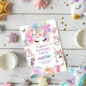 May include: A colorful unicorn birthday party invitation with a watercolor background. The invitation features a unicorn with a floral crown, a rainbow, and the text "Isabel's Birthday Party" with the date and time.
