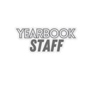 May include: Gray and white sticker with the text "Yearbook Staff" in a bold, outlined font.