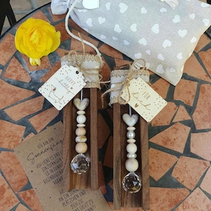 Suncatcher arranged on a wooden strip with a wooden pendant, 2 variations to choose from. The matching gift bag is available separately.