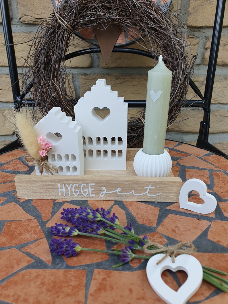 May include: A set of three ceramic mugs with a speckled, matte finish. The mugs are in shades of cream, light gray, and dark gray. Each mug has a simple, minimalist design, perfect for coffee or tea.