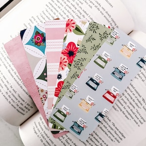 May include: A collection of colorful bookmarks featuring floral patterns, typewriter designs, and the text "You're Just My Type", "Happy Day", "Enjoy Today" and "You're Just My Type".