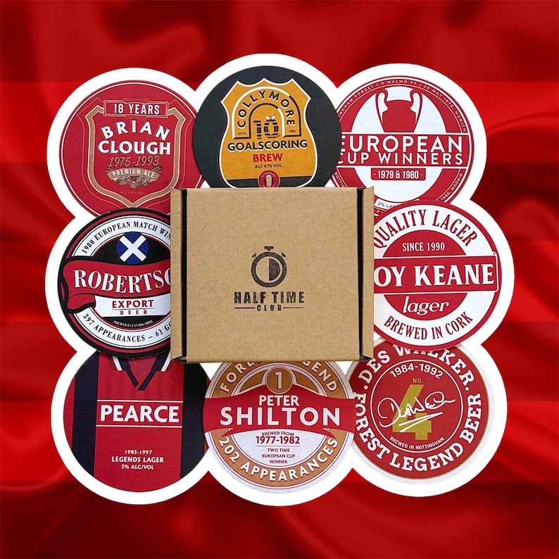May include: A set of 8 round coasters featuring images of famous Liverpool Football Club players and legends. The coasters are made of cork and have a red and white color scheme. The coasters are packaged in a brown cardboard box with the words "Half Time Club" printed on the front.