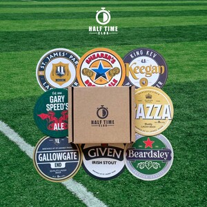 May include: A collection of eight round coasters featuring different Newcastle United Football Club logos and designs. The coasters are made of cardboard and have a glossy finish. The coasters are arranged in a circle around a brown box with the words "Half Time Club" printed on it.