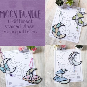 May include: A Moon Bundle set featuring 6 different stained glass moon patterns. The collection includes various crescent moon designs with decorative accents like butterflies, moths, and clouds, each crafted with colored glass and hanging loops.