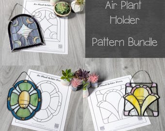 May include: A collection of stained glass air plant holders in various designs, including a moon and star motif, a floral design, and a geometric pattern. The image also shows pattern templates and small potted plants. Text reads: "Air Plant Holder Pattern Bundle."