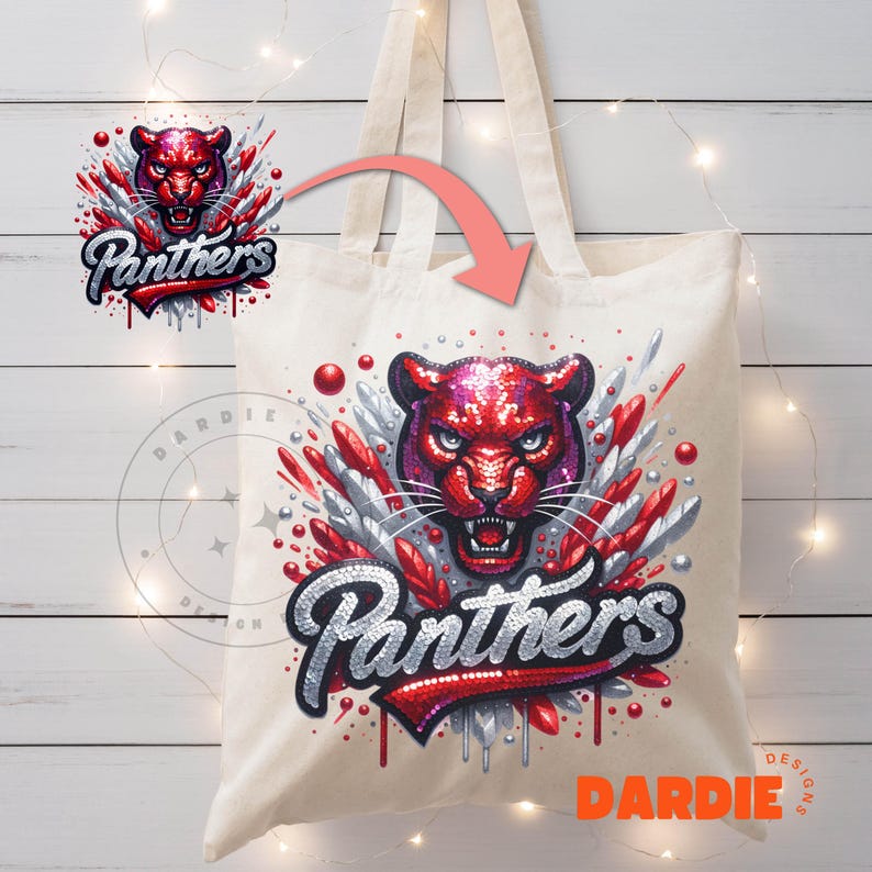 May include: A white canvas tote bag with a red and silver sequined design of a panther with the word "Panthers" in red sequins. The design is surrounded by silver sequins and red and silver glitter.