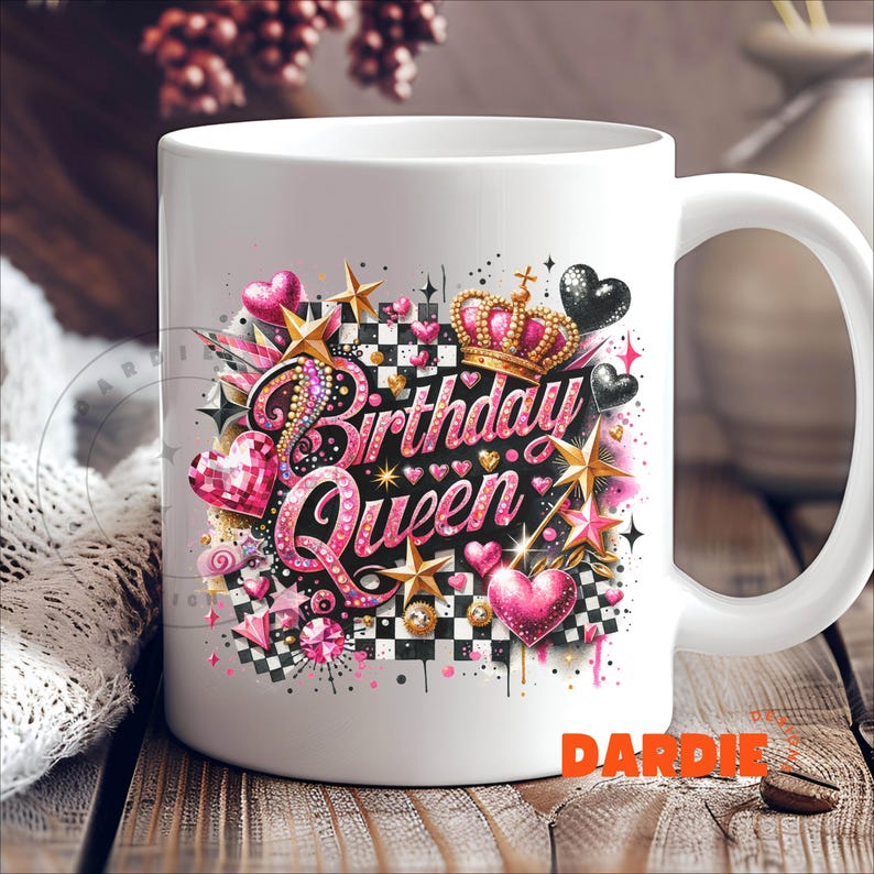 May include: White ceramic mug with a pink, black, and gold design featuring the words "Birthday Queen" and a crown. The design also includes hearts, stars, and checkered patterns.