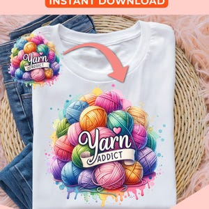 May include: White t-shirt with a colorful graphic of yarn balls and the text "Yarn Addict." The image also includes the text "Commercial Use PNG Images Instant Download" and the "Dardie Designs" logo. The shirt is laid on top of blue jeans.
