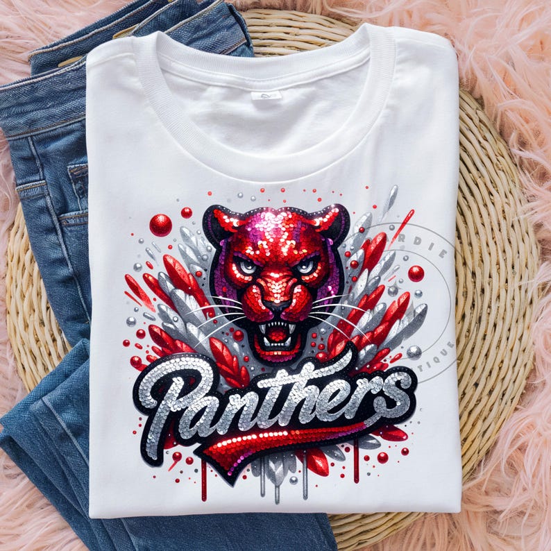 May include: White t-shirt with a red and silver sequined panther head and the word "Panthers" in red and silver sequins.