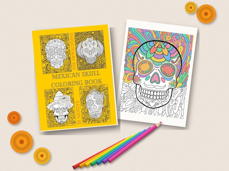 May include: A yellow colouring book titled MEXICAN SKULL COLORING BOOK with four skull illustrations on the cover, alongside a white page featuring a colourful skull drawing and a set of rainbow-coloured pencils arranged in a row below the items.