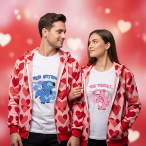 May include: Matching couple's outfits. White t-shirts with cartoon characters and the text "Her Stitch" and "His Angel". Pink zip-up hoodies with red hearts. A romantic theme is conveyed through the design.