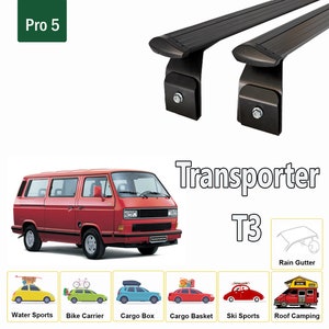 May include: A red Volkswagen Transporter T3 van with a black roof rack. The roof rack is labeled "Pro 5" and has a rain gutter. The van is shown with various accessories, including a water sports carrier, bike carrier, cargo box, cargo basket, ski sports carrier, and roof camping tent.