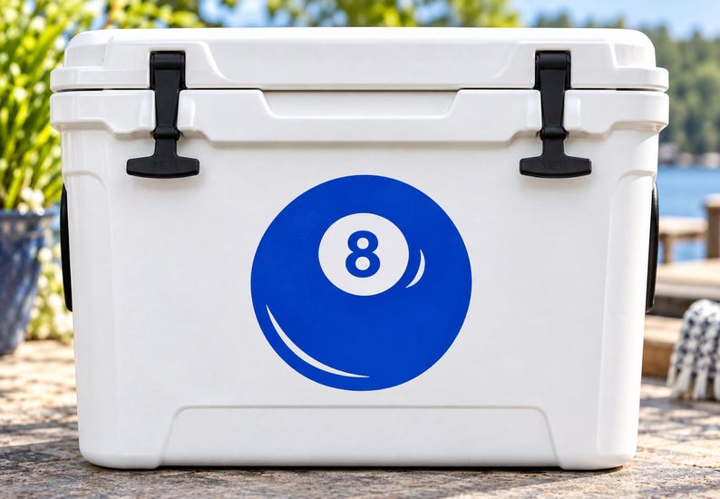 May include: A white rectangular cooler featuring a large blue circular graphic of an eight ball with the number eight centered in a white circle. The cooler has two black rubber latches on the top lid and a smooth, solid white exterior finish.