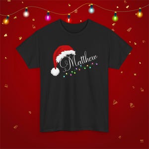 Custom Family Matching Christmas Shirts for Christmas Morning Custom Name With Santa Hat and Christmas Lights Festive Holiday T-Shirt