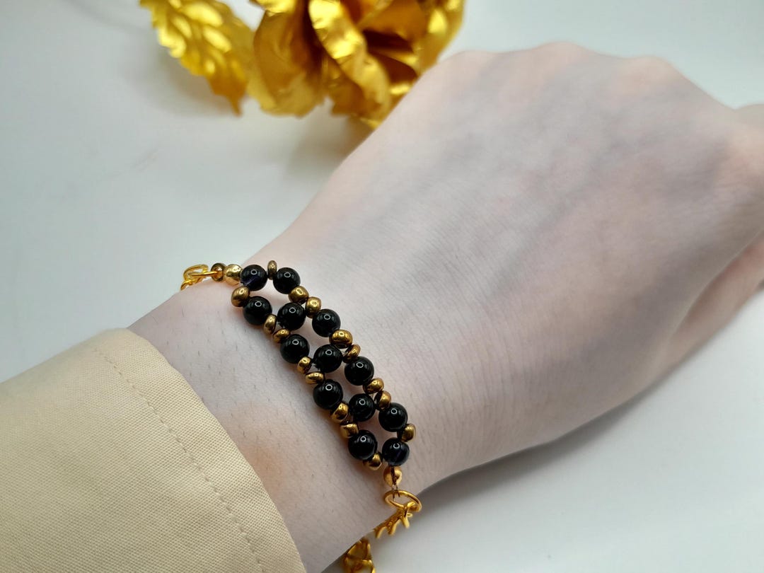 黒と金のビーズのレディースブレスレット | 美しい調節可能な 
