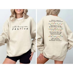 Friends TV Show Inspired Sweatshirt, Phoebe's Christmas Song "Monica, have a happy hanukkah" design on back, "Could I be any more festive" design on front