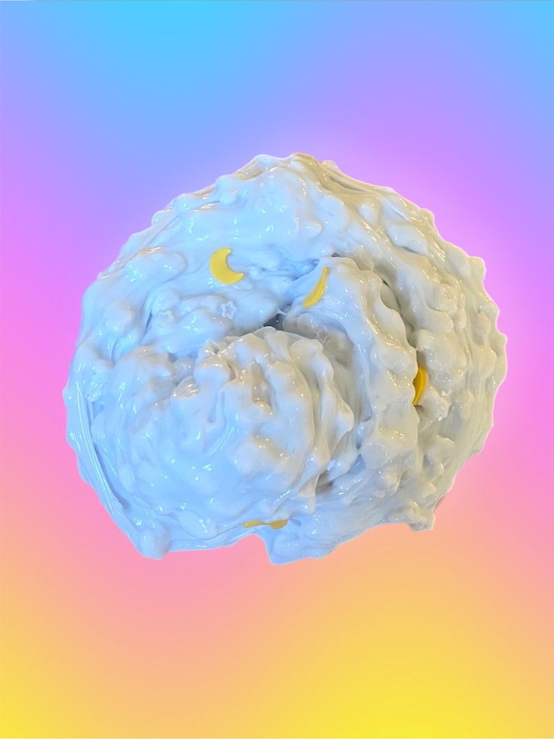 May include: A light blue, textured, blob-like object with yellow crescent moon shapes embedded within. The object has a glossy, reflective surface. The background transitions from blue to pink to yellow.