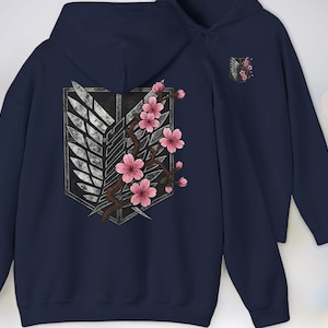 Buy a Gift for any Manga or Anime Fan – our Attack on Titan “Wings of Freedom” Hoodie with Sakura Blossom, Manga Anime Gift, Shingeki no Kyojin, Navy Hoodie, kawaii clothing, kawaii hoodie, gojo, gojo hoodie, anime decor, streetwear style, nerdy, jjk clothes, hoodie, anime, jujutsu kaisen gifts, jujustu kaisen, jujutsu kaisen geto