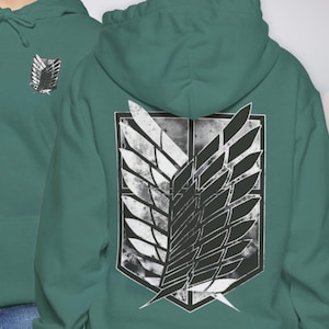 May include: A teal hoodie featuring a black and white emblem on the back and a smaller version on the front. The emblem is a stylized wing design within a shield shape, with a distressed, vintage aesthetic.