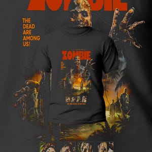 May include: Black t-shirt with the poster art for Lucio Fulci's "Zombie." The design features the film's title in orange, a zombie face, and the phrases "The Dead Are Among Us!" and "We Are Going to Eat You!"