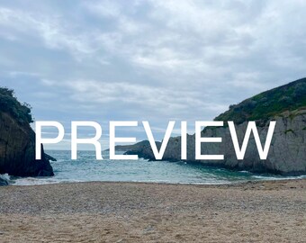 May include: A view of a beach with a rocky outcropping on either side. The water is blue and the sky is cloudy. The word "PREVIEW" is superimposed on the image.