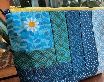 Tas met ritssluiting in patchwork-madeliefje